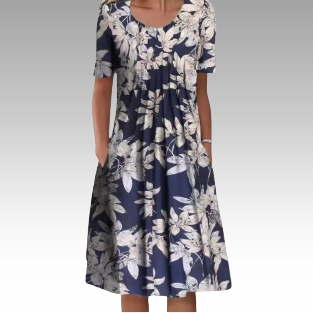 Ziva – Elegant Klänning med Blommönster och Magtäckning