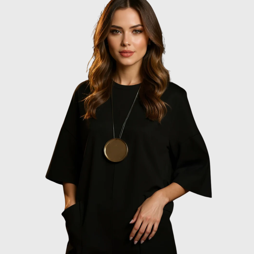 MATILDA – MINIMALISTISK AVSLAPPNAD JUMPSUIT