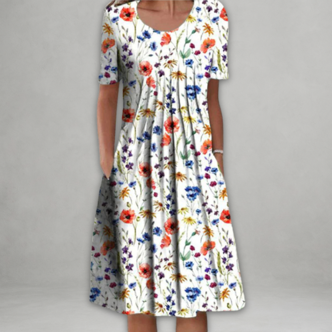 Eira - Elegant Klänning med Blommönster Som Täcker Magen