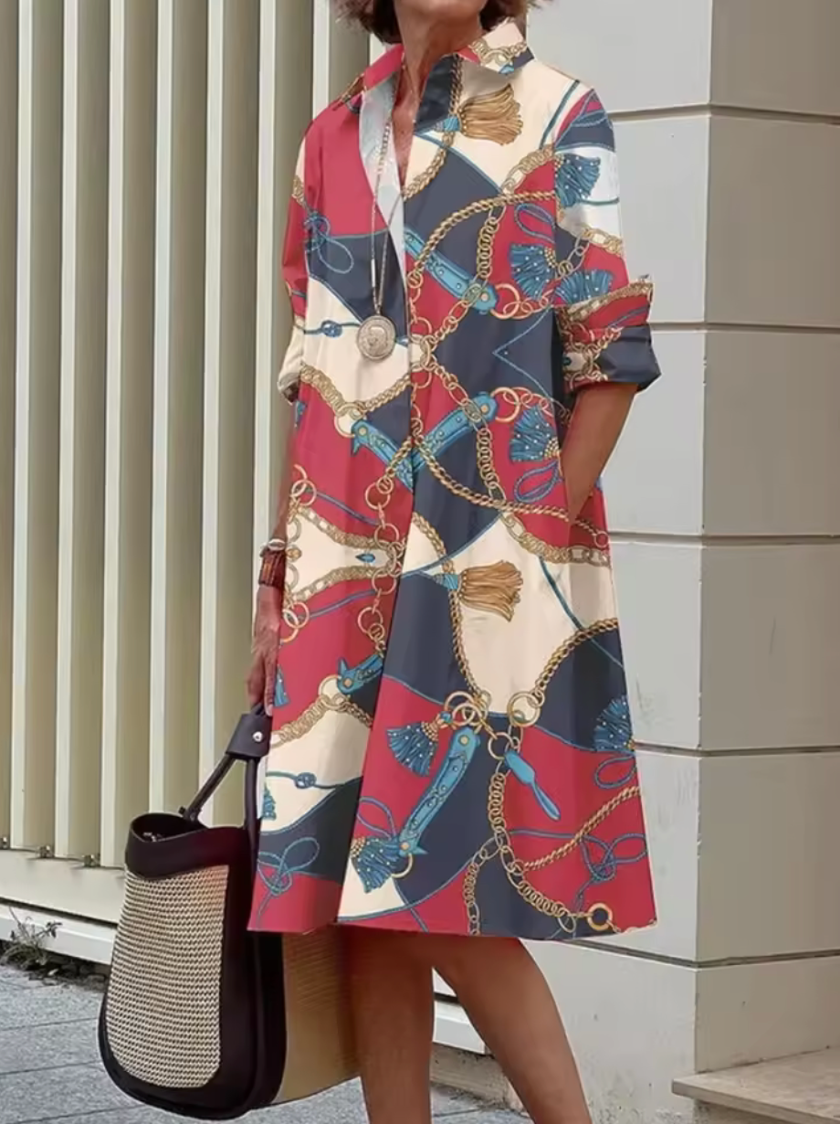 Elva - Stilfull Midiklänning med Geometriska Ränder